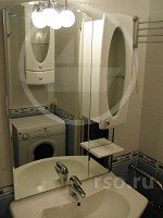 Монтаж полотенцесушителя в ванной комнате городской квартиры